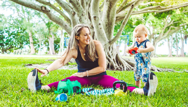 istock Woman exercises outdoors with her toddler son 1278032619