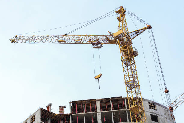 istock Construction crane stands on the background of the sky. Construction site. Tower crane. 1278036201