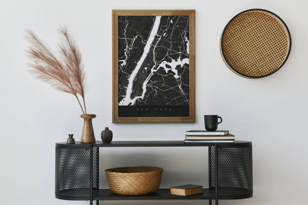 istock Modern scandinavian home interior with design wooden commode, mock up poster map, feather in vase, book and personal accessories in stylish home decor. Template. 1278038073
