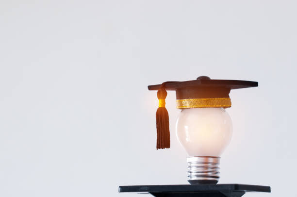 istock Education or Graduate study Creative concept: Hands holding light bulb with Graduated hat on gray background. Ideas with innovation creativity for Educational successs studies world. back to School 1278038794
