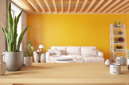 Wooden Table Top with Blur of Cozy Living Room. 3d Render