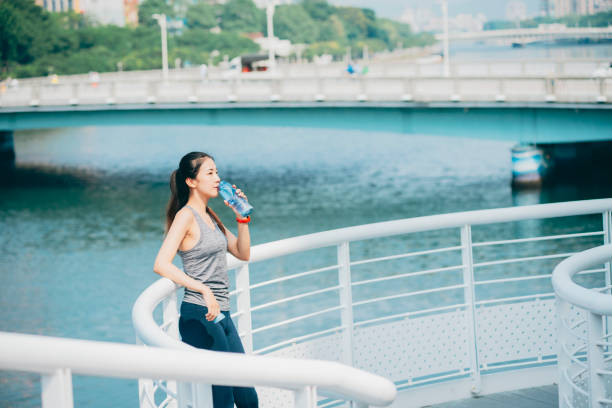 istock Female athlete drinking water 1278044550