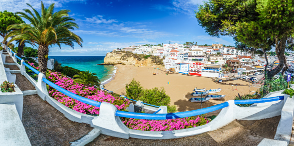 Carvoeiro town with colorful houses and yellow sand beach in Algarve, Portugal