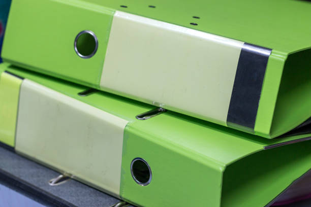 Business report green binders folder rows for insert information paper document tag label and storage at offices sheles in organization management in data