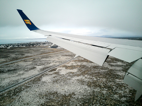 Keflavik, Iceland - February 12, 2020: an Icelandair commercial airplane landing at the Keflavik International Airport.
