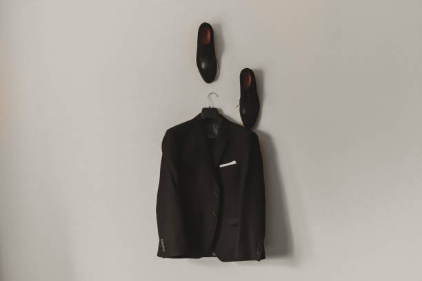 istock Men dark blue brown black formal classic blazer hanging 1278055900