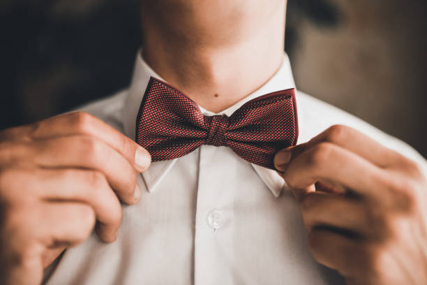 istock man in a white shirt straightens his tie 1278056493