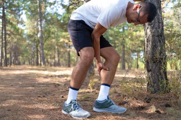 istock Young runner man is leaning on tree with muscle pain due to calf muscle pull. 1278056730