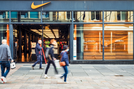Glasgow, Scotland - Motion blur on pedestrians outside a Nike Store on Buchanan Street in central Glasgow.