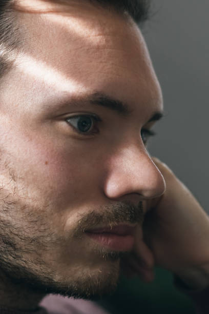 istock Closeup of a thoughtful man in shadow 1278058612