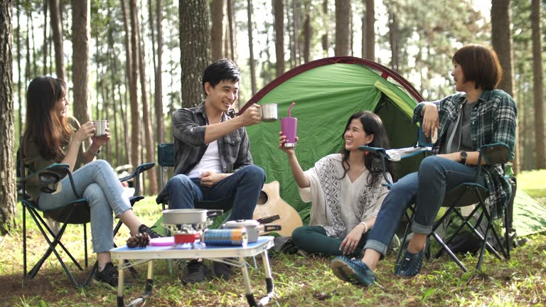 Group of young asian girls camping at forest