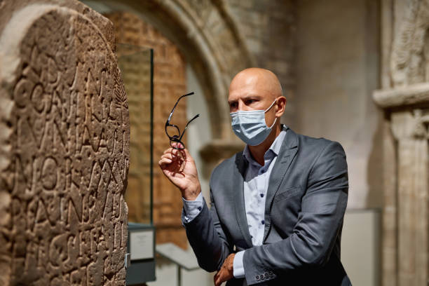 istock Man looking at museum exhibition 1278063784