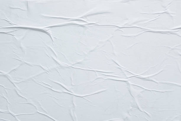 istock Crumpled white paper. Blank street poster texture. 1278065141