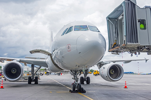 Plane ladder connected to airplane and ready to pass people at the airport