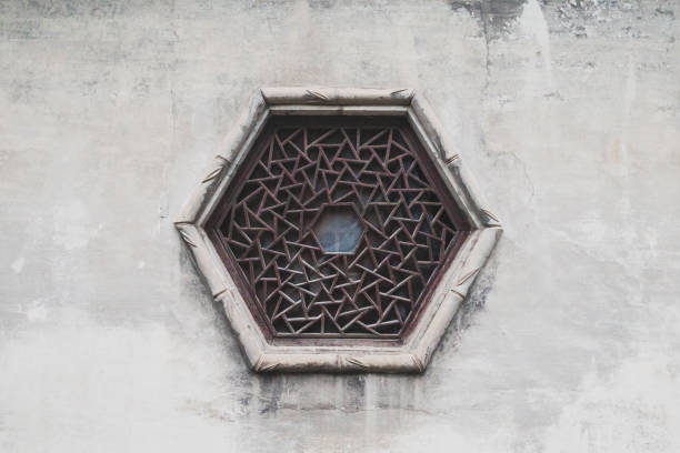 Background texture of traditional Chinese hexagon window on white wall