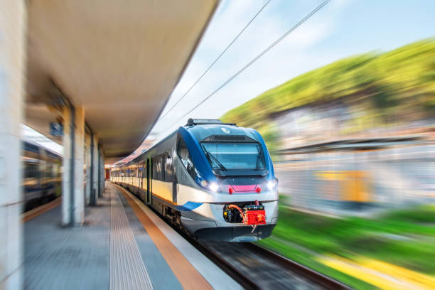 istock Express commuter suburban train passing through the passenger station. 1278068597