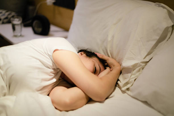 istock asian young woman sleeping at home 1278069360
