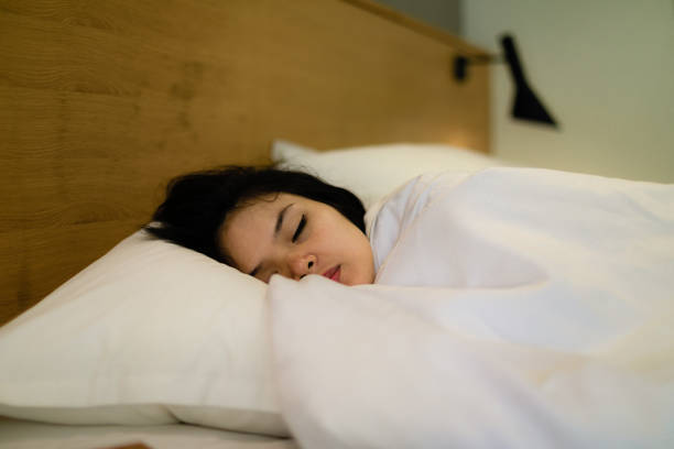 istock asian young woman sleeping at home 1278070360