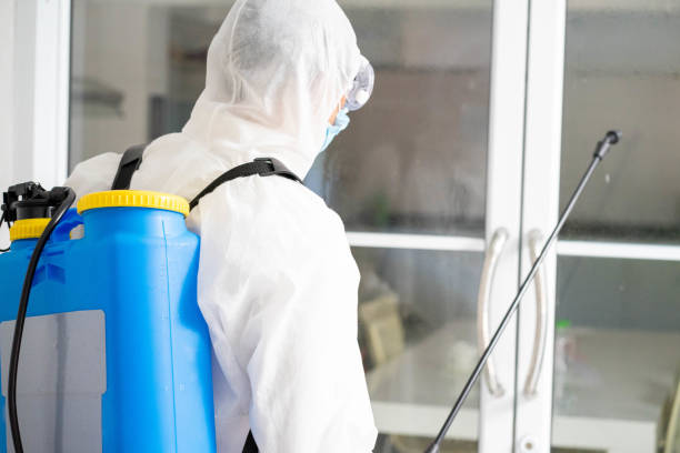 istock health care worker in white jumpsuit and protective face mask using spraying machine to disinfect virus pandemic.  Health care and midicine concept. New normal social distancing concept. 1278074203