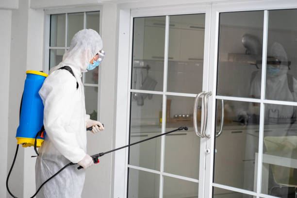 istock health care worker in white jumpsuit and protective face mask using spraying machine to disinfect virus pandemic.  Health care and midicine concept. New normal social distancing concept. 1278074253