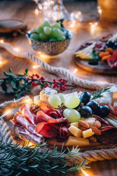 istock Festively Decorated Table With Cutting Boards And Delicacies On Them 1278074914