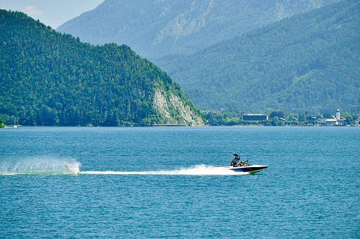 One people wakeboarding behind speedboat on Lake Geneva, Switzerland.
