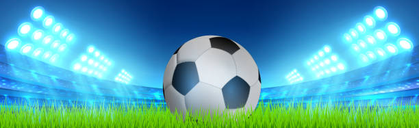 istock Realistic soccer ball on a green soccer lawn 1278077680