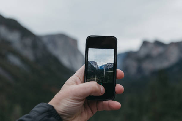 istock Mobile phone in hand at Tunnel View 1278080229