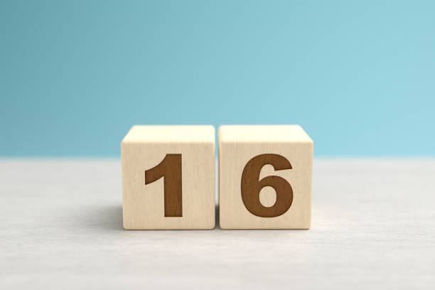 istock Wooden toy blocks forming the number 16. 1278080384