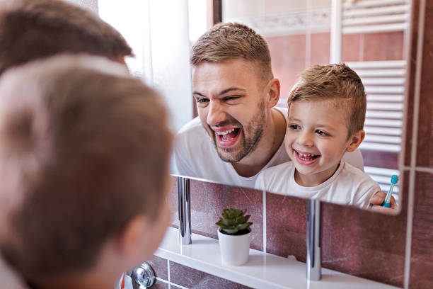 istock Father And Little Son Brushing Teeth In The Morning 1278086421