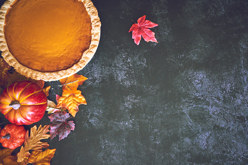 Pumpkin Pie for the Holidays on Rustic Background