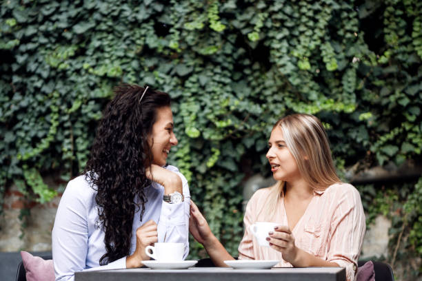 istock Women friends talking together drinking coffee 1278087341
