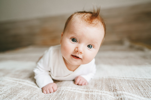 Cute Baby Ginger Hair Close Up Crawling On Bed Smiling Adorable Kid  Portrait Family Lifestyle 3 Month Old Child Stock Photo - Download Image  Now - iStock