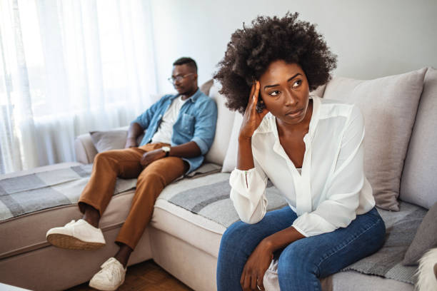 istock Offended man and woman are seated separately on sofa 1278100929
