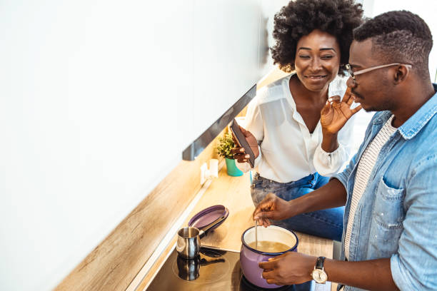 istock Attractive couple is cooking on kitchen 1278102352