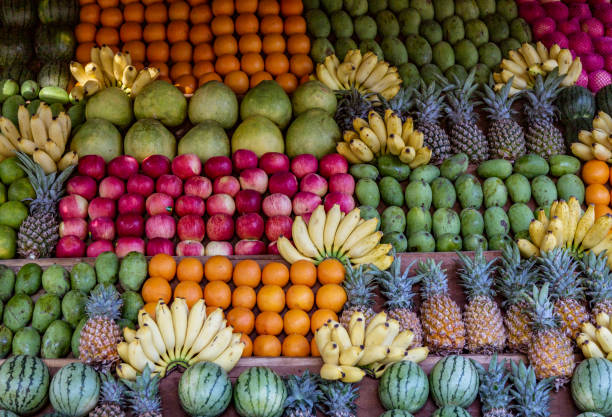 istock Watermelon, Banana, Orange, Pineapple and Other Fruit on Stand 1278105571