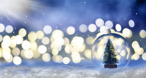 istock Crystal Christmas ball on snow and christmas tree. 1278107123