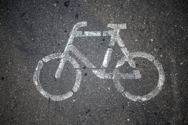 Bicycle or road sign. On asphalt. The view from the top. stock photo