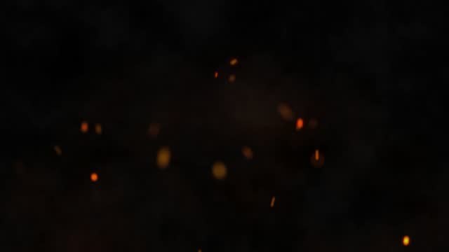 Burning hot bonfire fire sparks on a dark background. Flying Embers from fire. 4K
