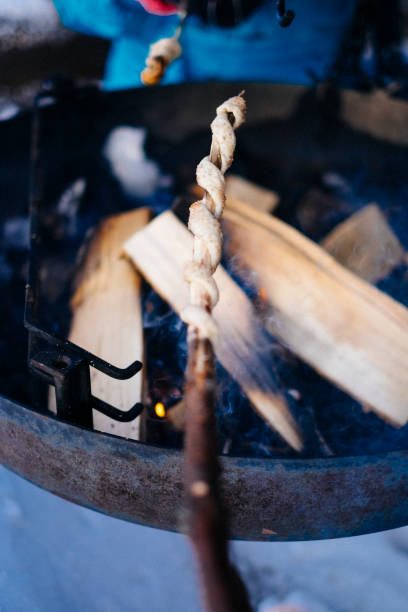 istock Grilling bread over a bonfire outdoors 1278111986