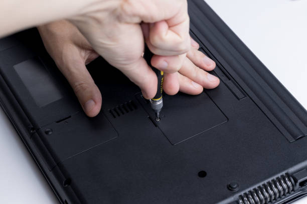 istock close up view for a technician worker repairing or adjusting laptop pc. person using work tool to open memory module socket. laptop and computer service conceptual 1278112370