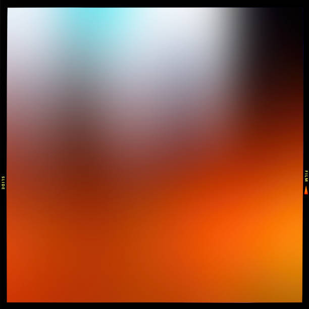 Blurred abstract multicolored background in a black frame along the contour, slide film.