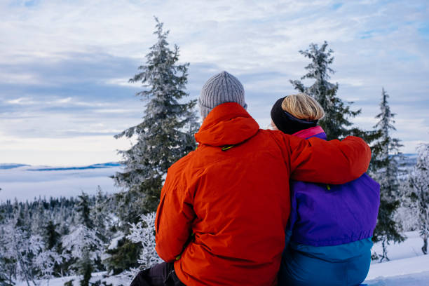 istock Young couple enjoying the winter landscape view 1278113613