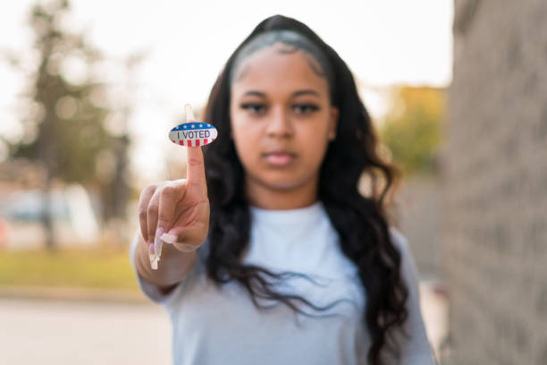 istock Young woman holds up 