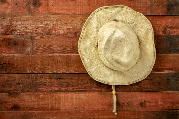 istock straw cowboy hat hanging on weathered barn wall 1278121701