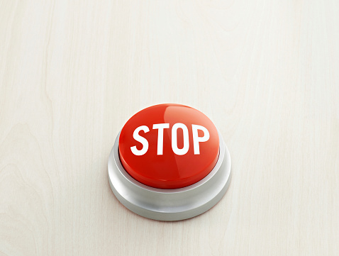 Red push button with ”Stop\