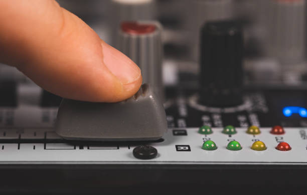 istock Sound engineer using main control fader of studio mixer. 1278126365