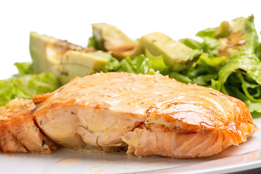Grilled steak of wild salmon in mustard sauce and salad