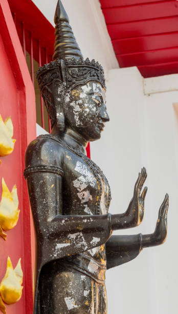 istock Side View of Standing Thai God With Palms Held Forward 1278136883