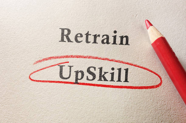 Upskill circled in red pencil below Retrain text on textured paper Upskill circled in red pencil below Retrain text on textured paper  --  job training concept job retraining stock pictures, royalty-free photos & images